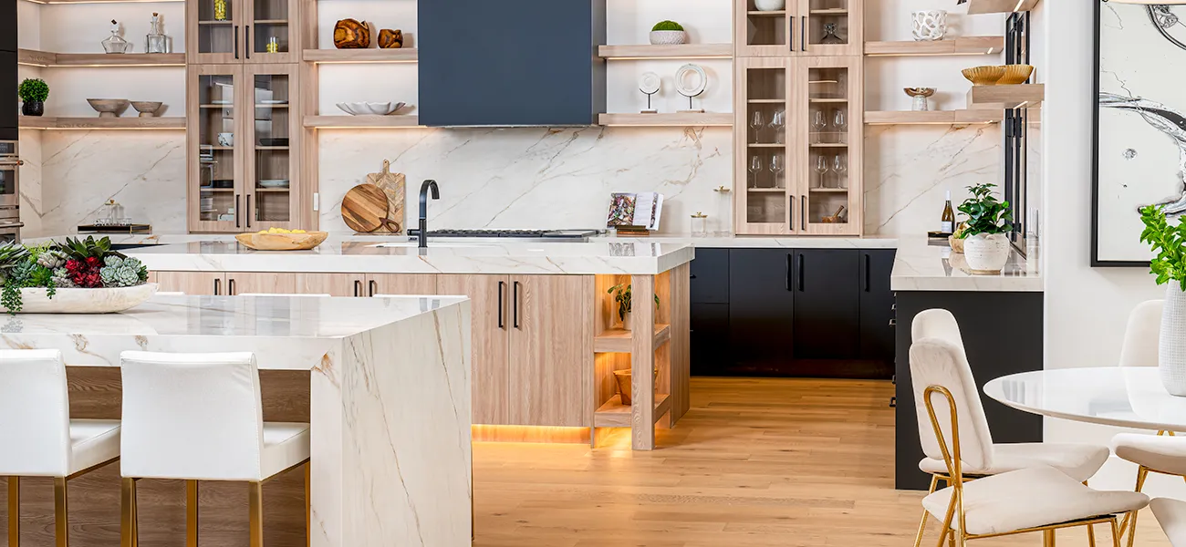 A modern kitchen with marble countertops, wood cabinetry, open shelving, and soft ambient lighting for a warm and elegant look.