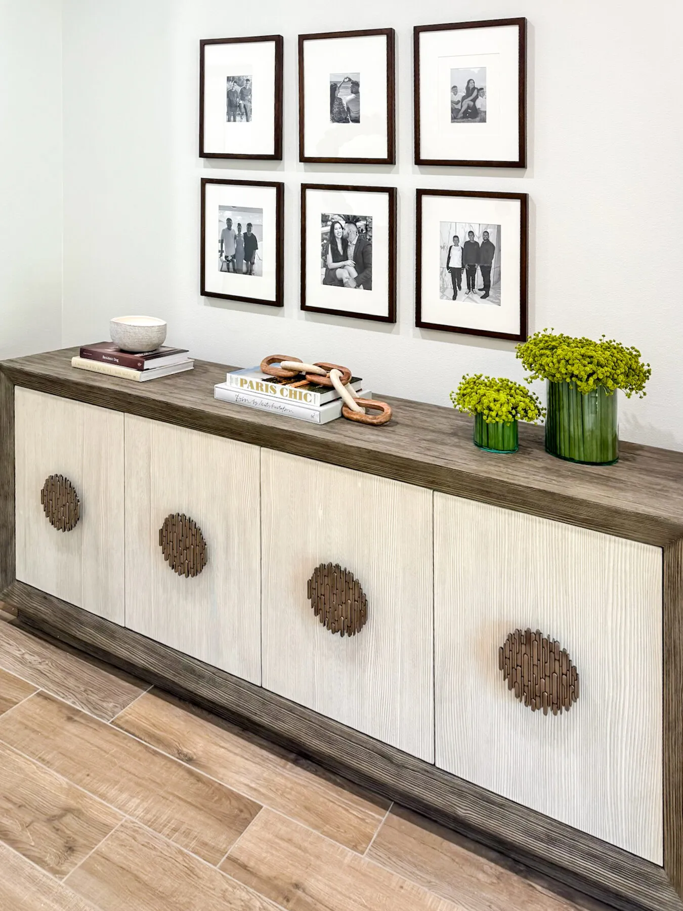 Family Gallery Wall Above a Sculpted Console