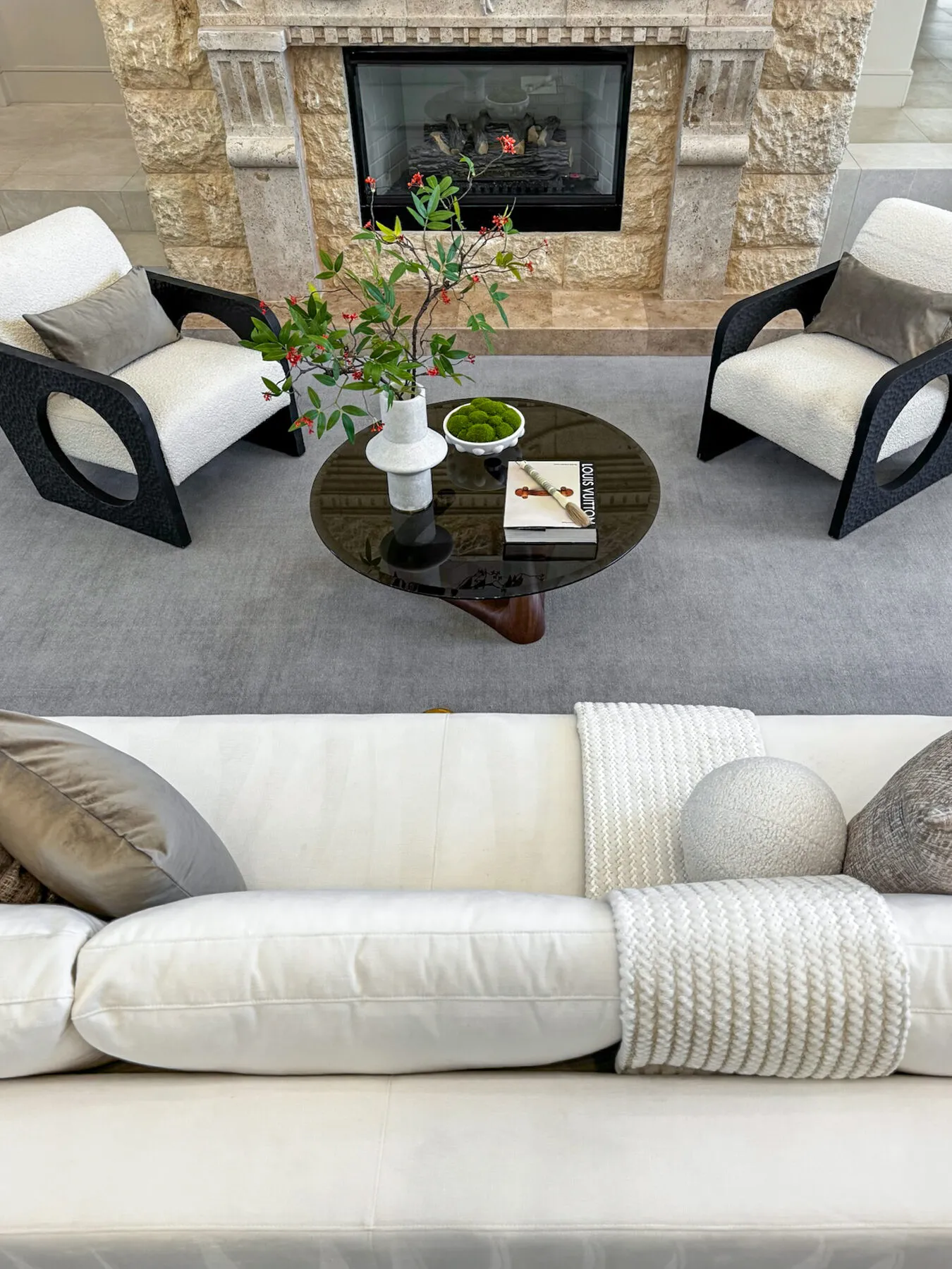 Boucle Chairs Facing the Stone Fireplace