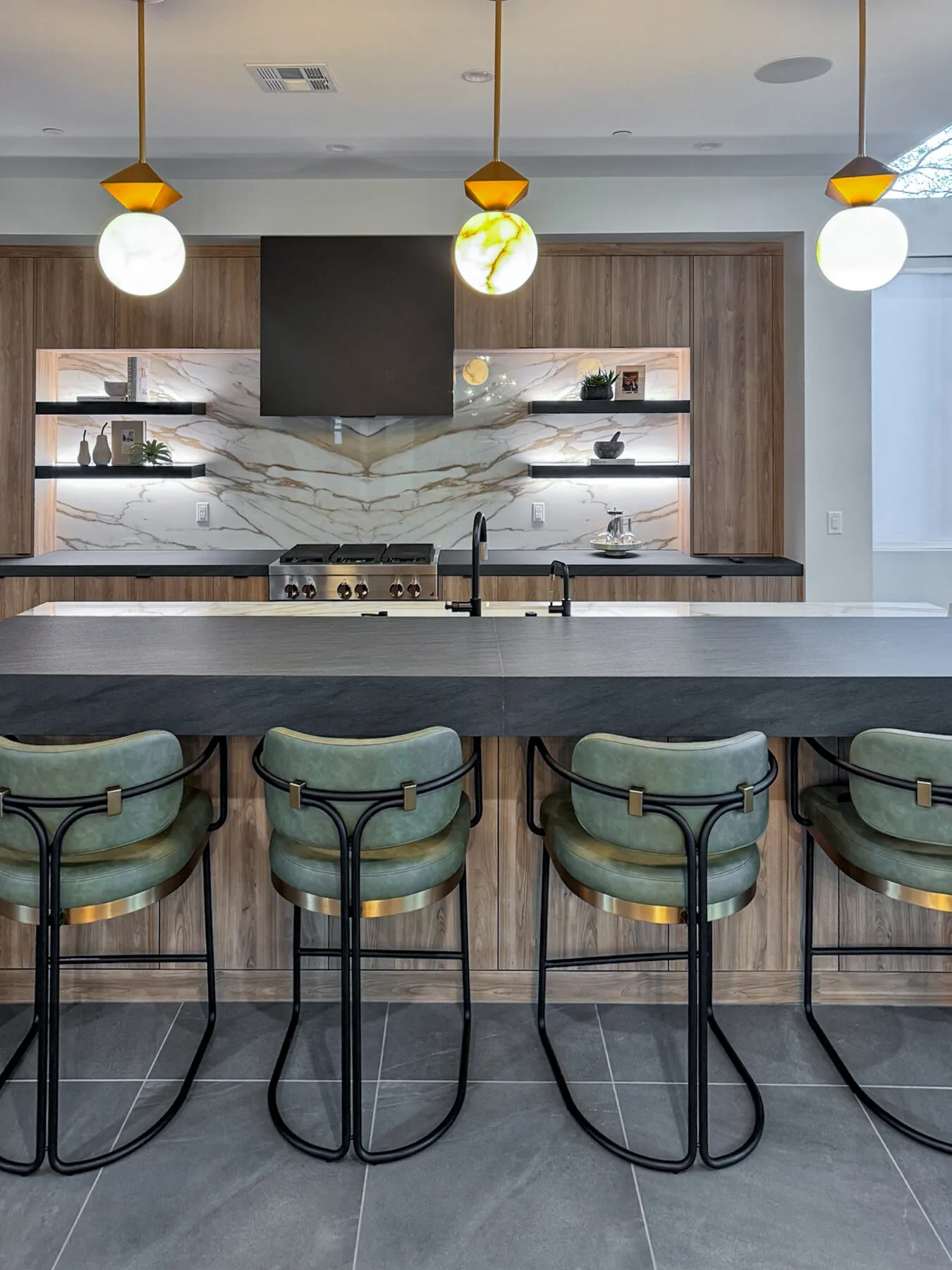 Walnut Kitchen with Sage Barstools and Globe Pendants