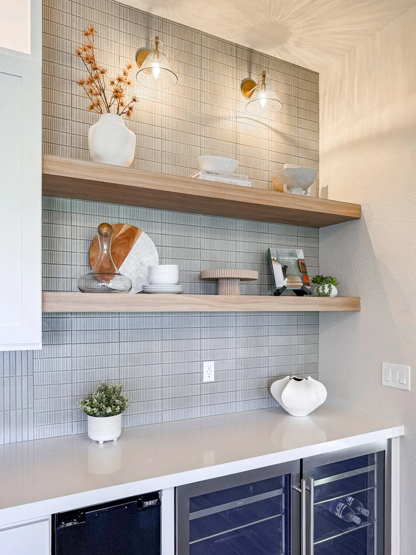 Floating Oak Shelves Above a Vertical Mosaic Tile