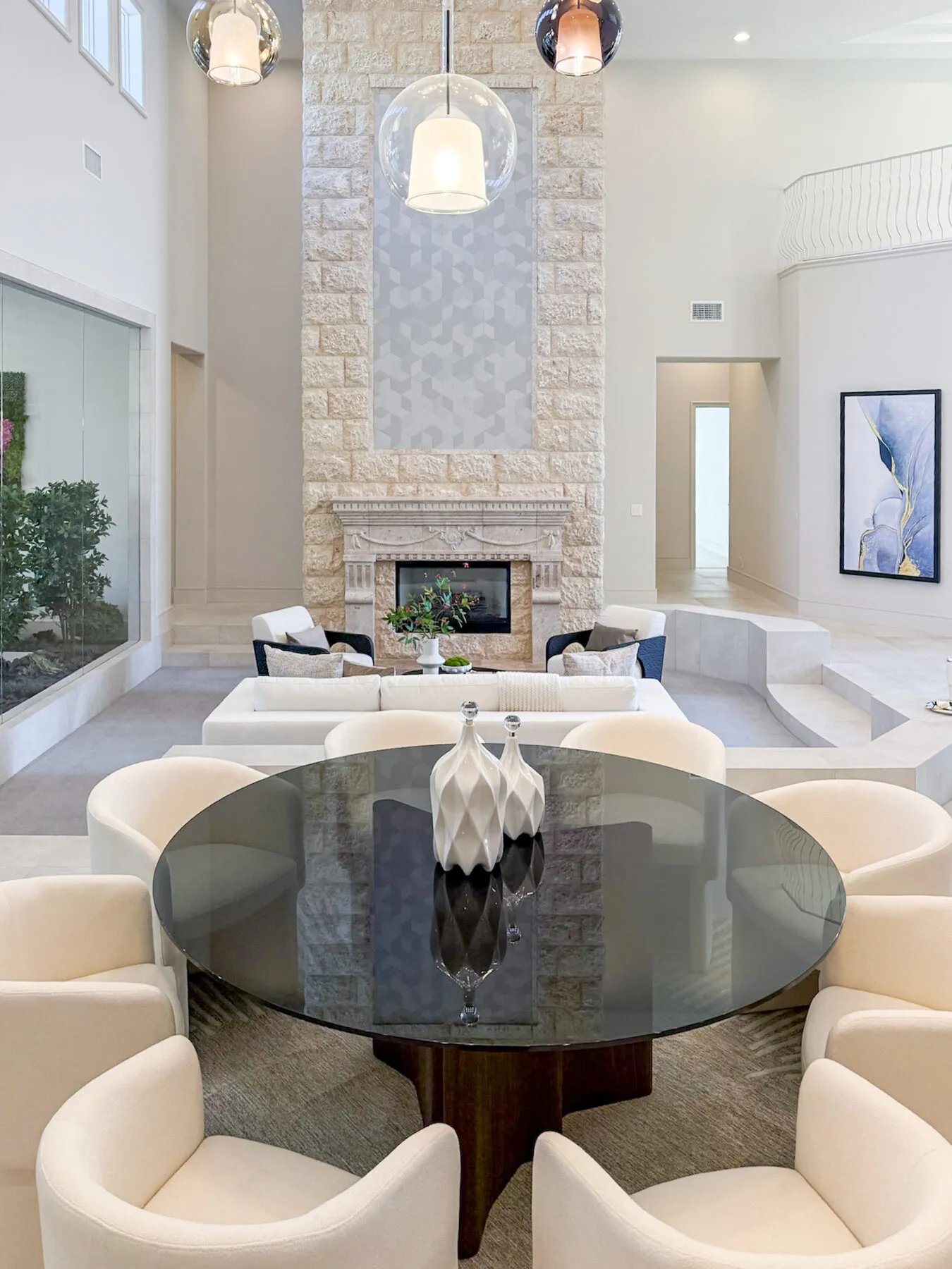 Dining Beyond a Stone Fireplace Cascade