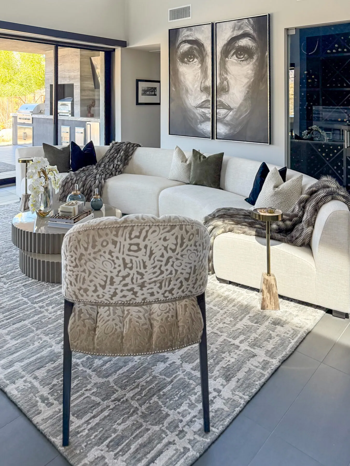 Embroidered Chair Facing a Portrait Diptych