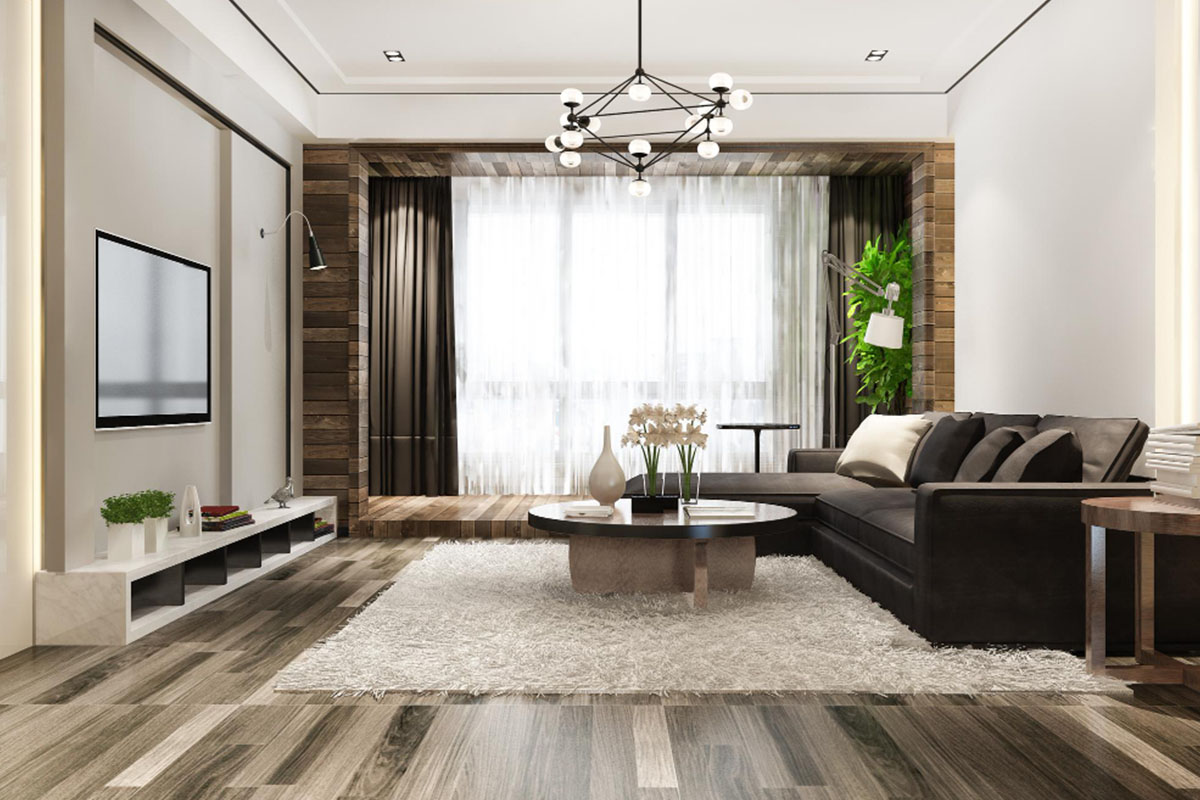 Modern living room with gray sofa, wooden coffee table, armchairs, and decorative lighting.