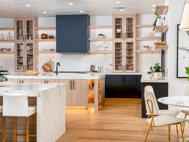 Exquisite Home Staging showcasing a modern kitchen with warm wood cabinetry, white marble countertops, and open shelving.